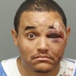 Raleigh PD detective Christopher Reed booking photo after bar brawl arrest